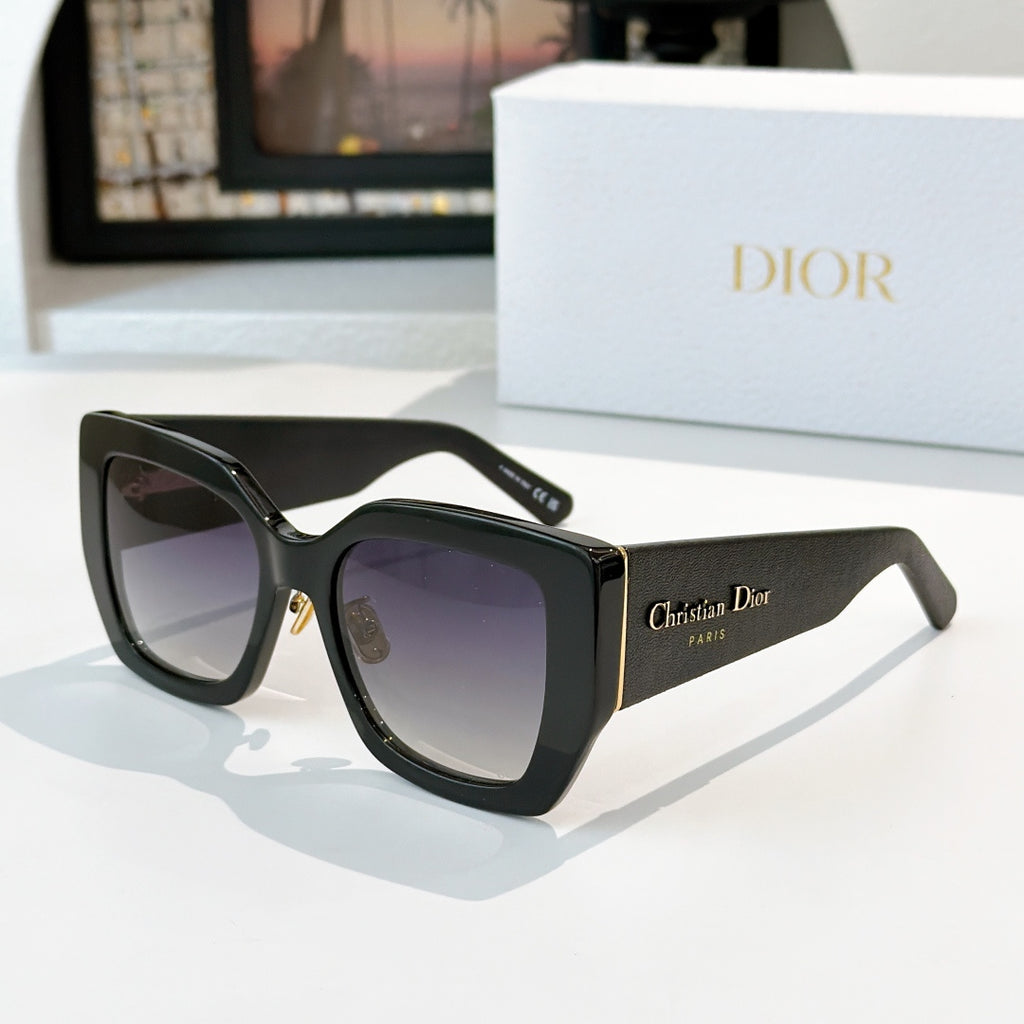 Dior sunglasses with black frames and purple gradient lenses