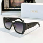 Dior sunglasses with black frames and purple gradient lenses