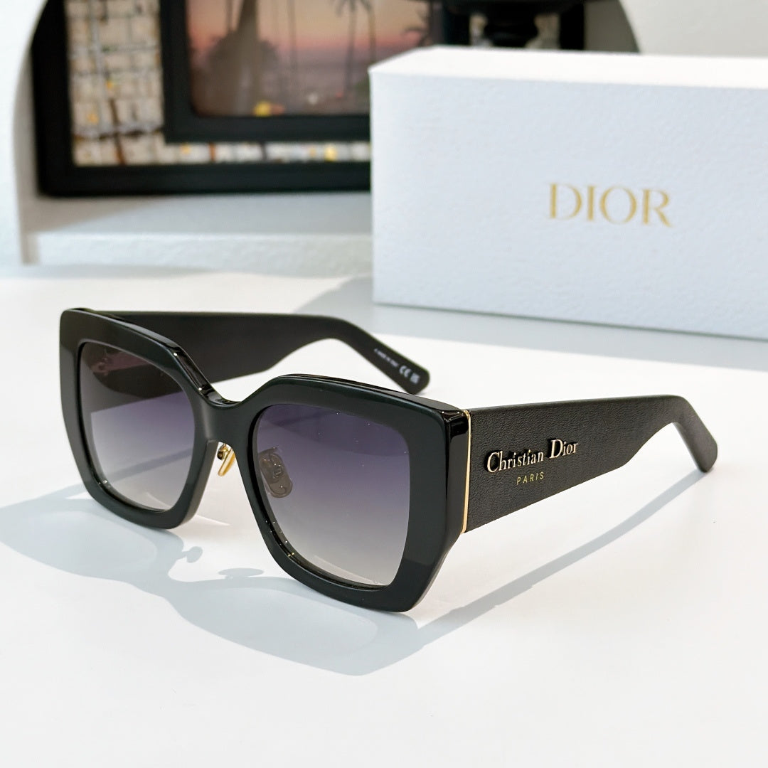 Dior sunglasses with black frames and purple gradient lenses