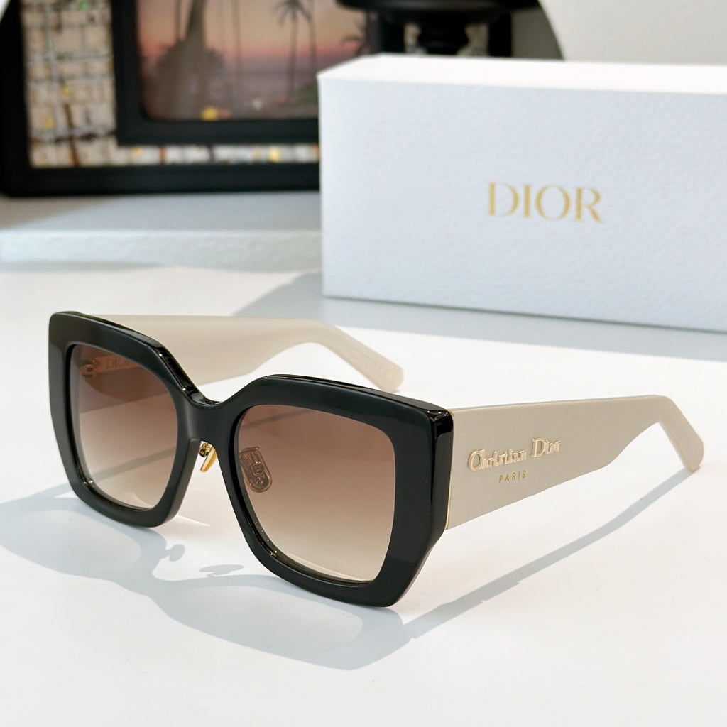 Dior sunglasses with black frames and light brown gradient lenses
