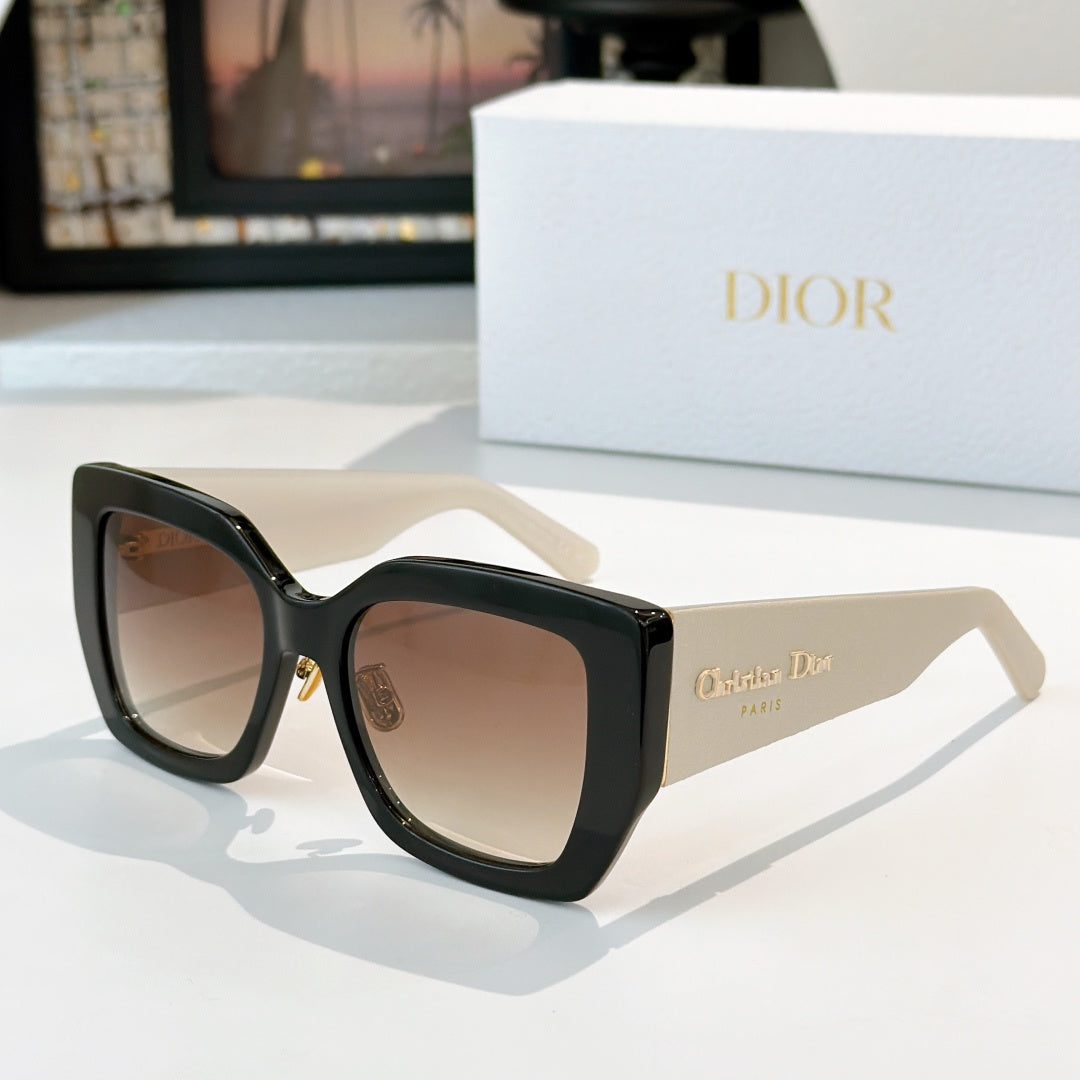 Dior sunglasses with black frames and light brown gradient lenses