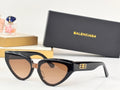 Black cat-eye sunglasses with gold B logo on temples