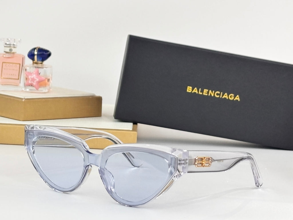 Light blue cat-eye sunglasses with clear arms and gold B emblem