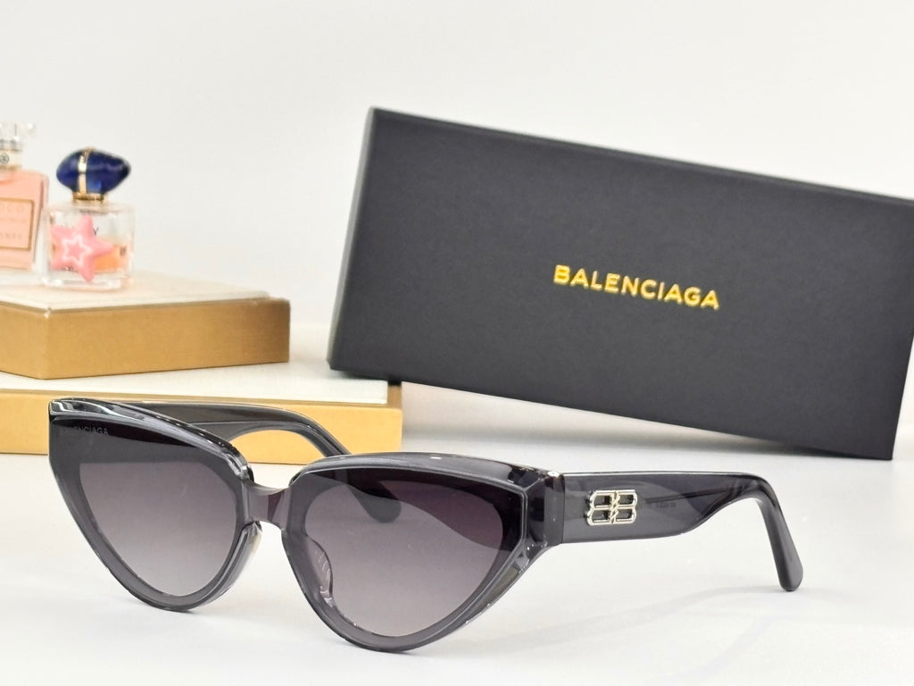 Black cat-eye sunglasses with dark lenses and gold B temple emblem