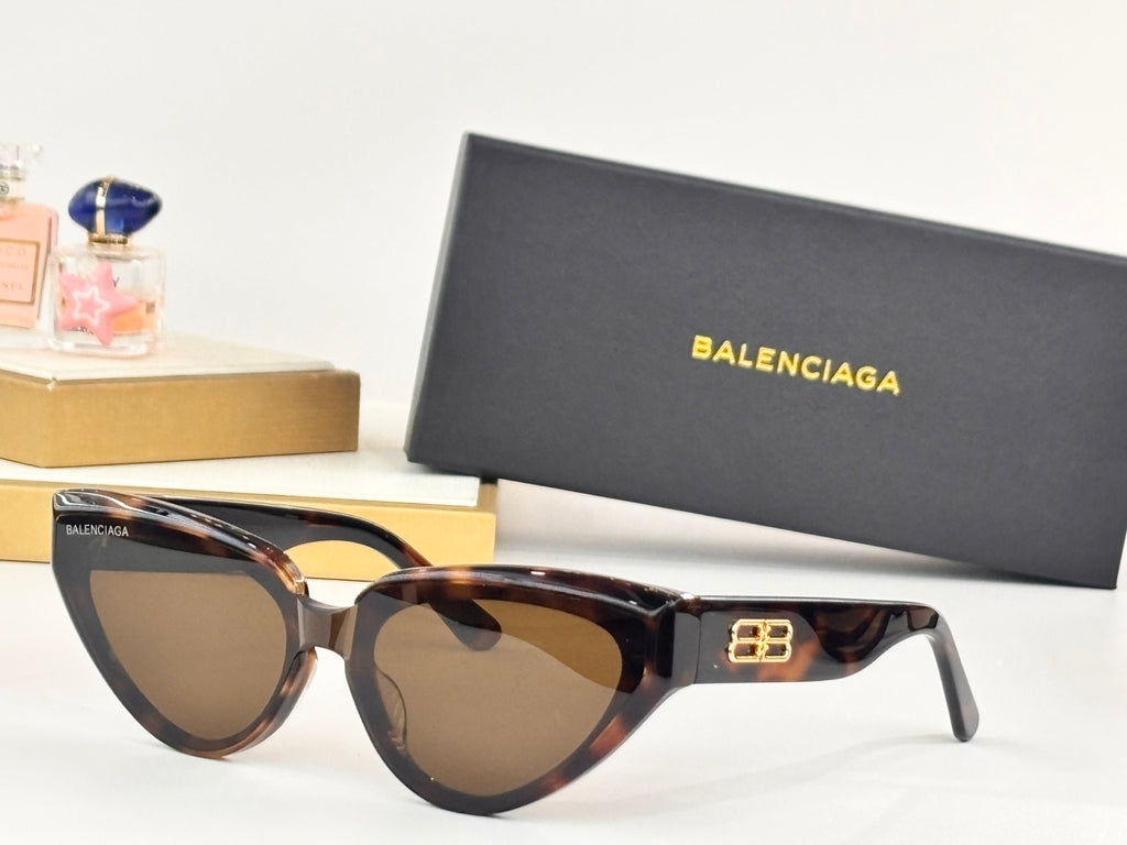 Tortoiseshell cat-eye sunglasses with tan lenses and gold B logo