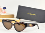 Tortoiseshell cat-eye sunglasses with tan lenses and gold B logo