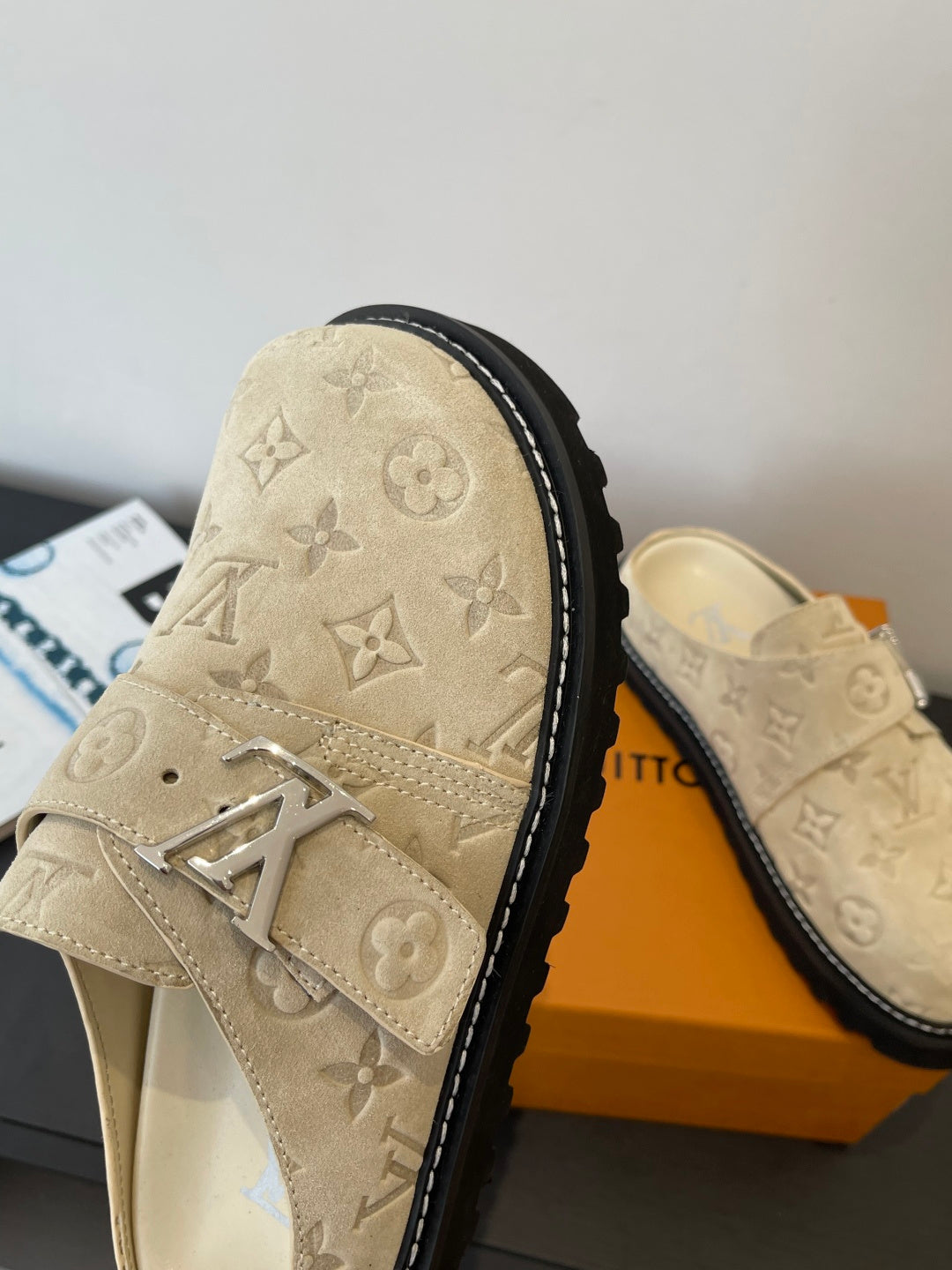 Louis Vuitton beige monogram sandals with wide front strap and black-trimmed sole