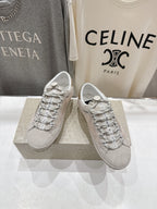 Golden Goose light gray lace-up sneakers with patterned laces and side logo detail