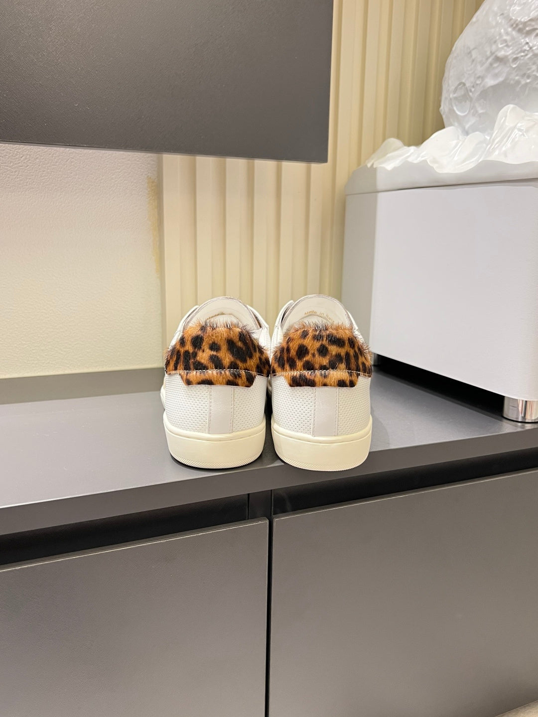 YSL unisex sneakers, rear view with leopard print heel lining and white rubber sole