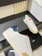 YSL unisex sneakers, white perforated knit with navy side panel and red logo accent