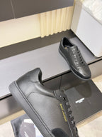 Dark gray lace-up sneaker with textured side panel and front eyelets