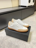 Unisex lace-up sneakers, white upper with tan sole and beige heel tab