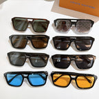 Assorted sunglasses with mixed black, brown, and blue lenses, shown together.