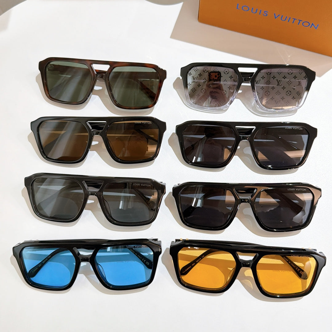 Assorted sunglasses with mixed black, brown, and blue lenses, shown together.