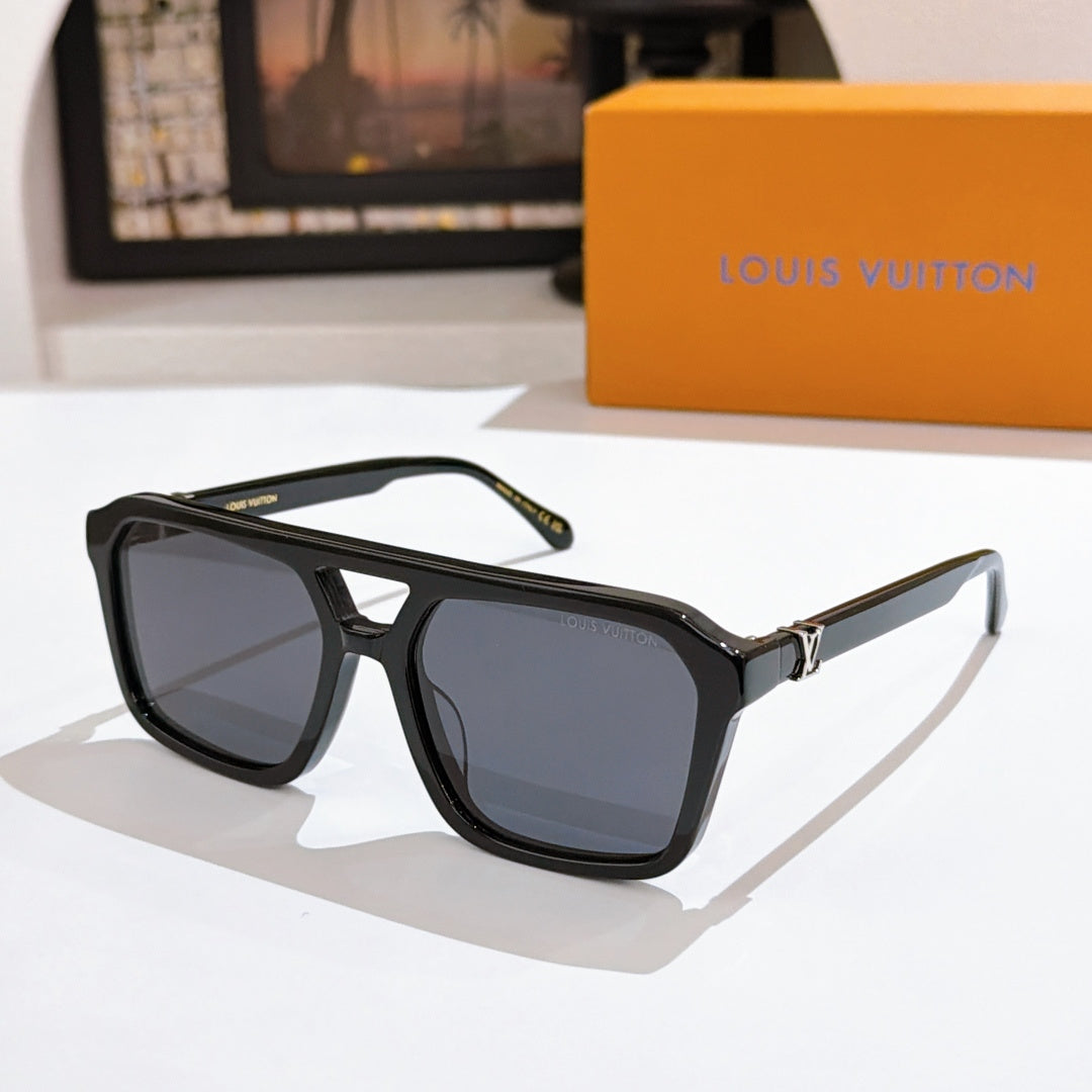 Black acetate sunglasses with dark gray lenses and monogram temples.