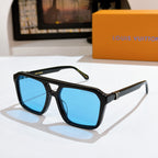 Black sunglasses with bright blue lenses and gold bridge detail.