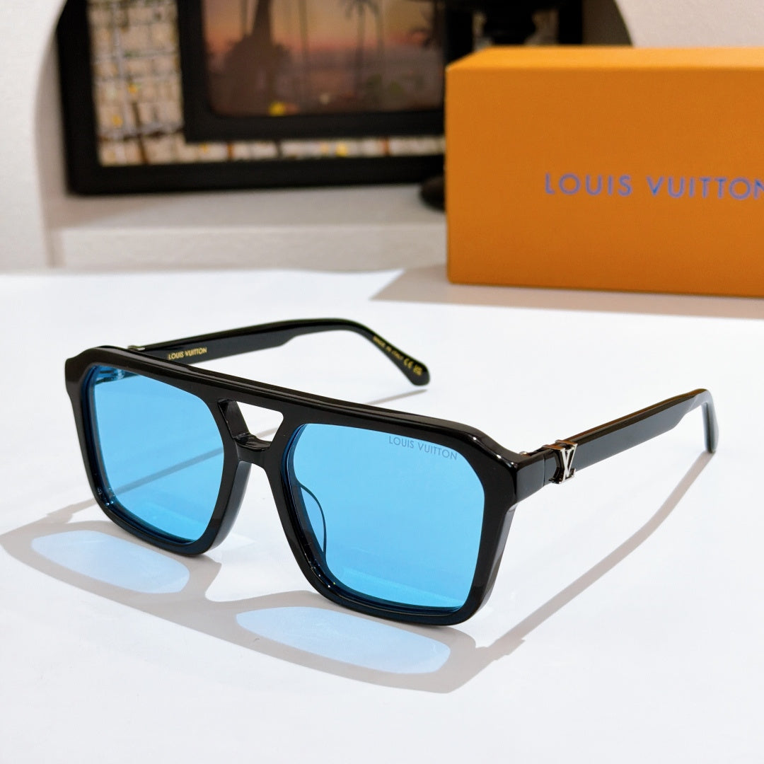 Black sunglasses with bright blue lenses and gold bridge detail.