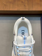 White sneaker with blue logo patch on tongue and plaid accents on collar
