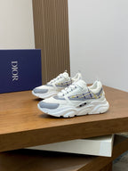 White low-top sneakers with light blue accents, plaid details, and thick sole