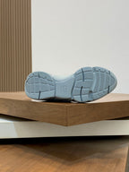 Light blue sneaker outsole with tread pattern on chunky sole