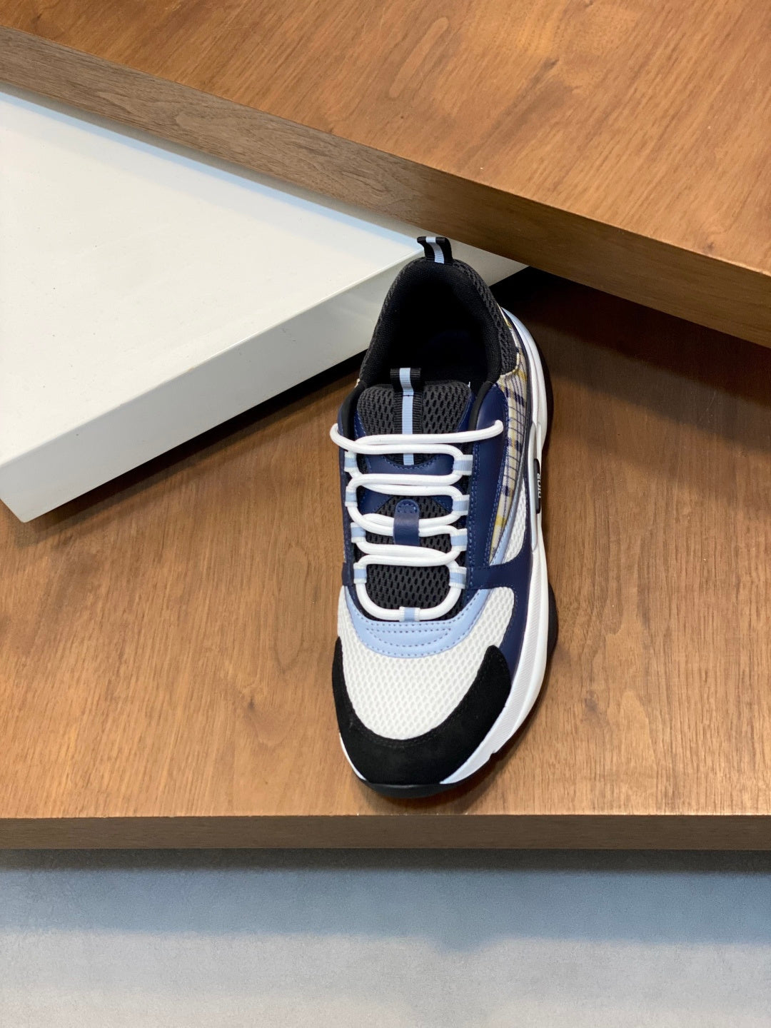 Dior unisex lace-up sneakers, navy and white uppers with light blue stripe detail