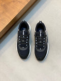 Black mesh Dior unisex sneakers, lace-up with chunky white sole and blue-striped accents