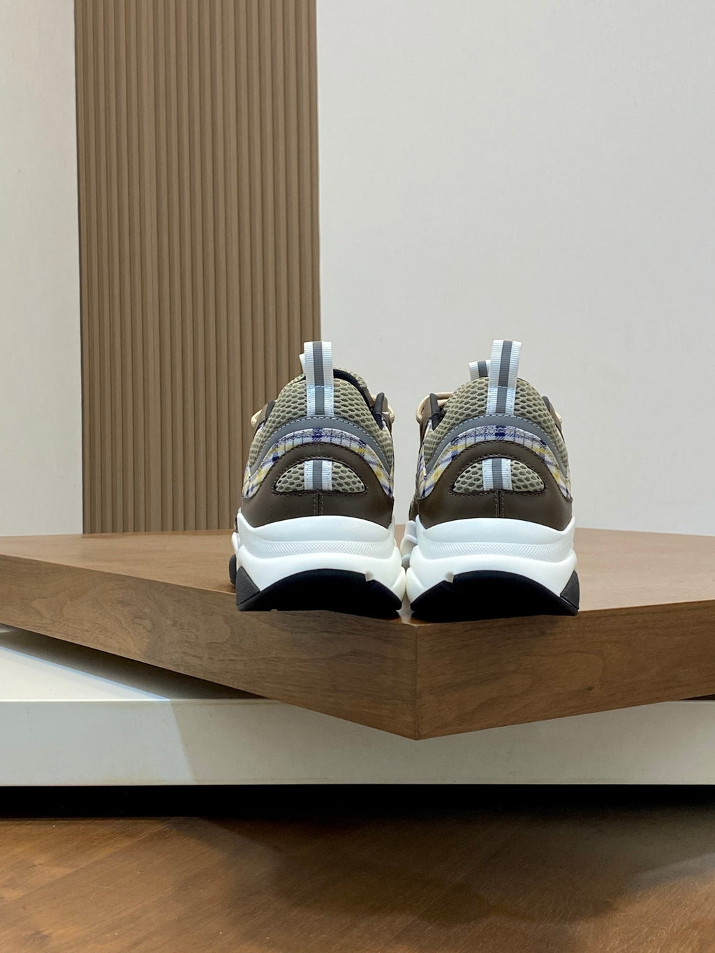 Unisex sneakers back view, beige and navy uppers with light plaid straps