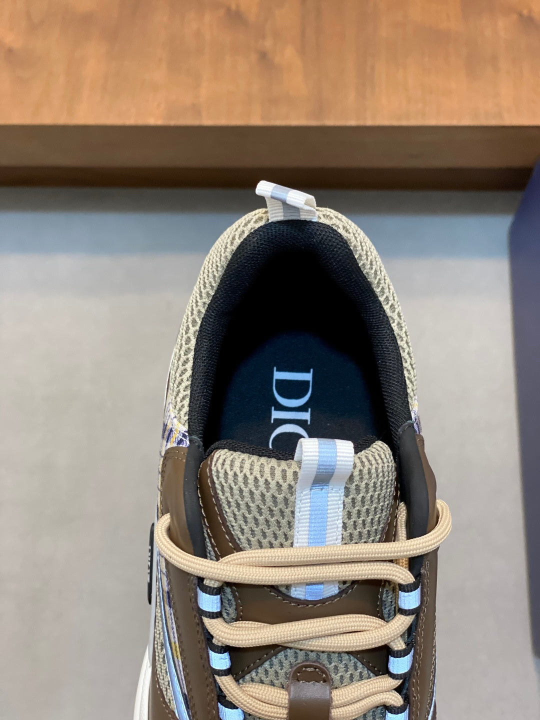 Unisex sneaker interior and tongue, Dior logo on navy lining
