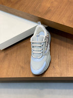 Light blue mesh lace-up sneaker with padded collar and cushioned tongue