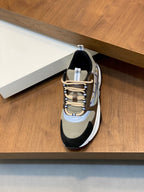 Unisex sneaker side view, beige mesh upper with navy trim and white sole