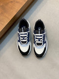 Dior unisex sneakers in navy, light blue, and white with lace-up and chunky sole