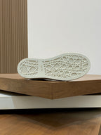 White rubber sneaker outsole with textured tread pattern