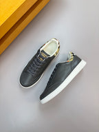 Dark navy lace-up sneakers with white sole and patterned lining at the collar