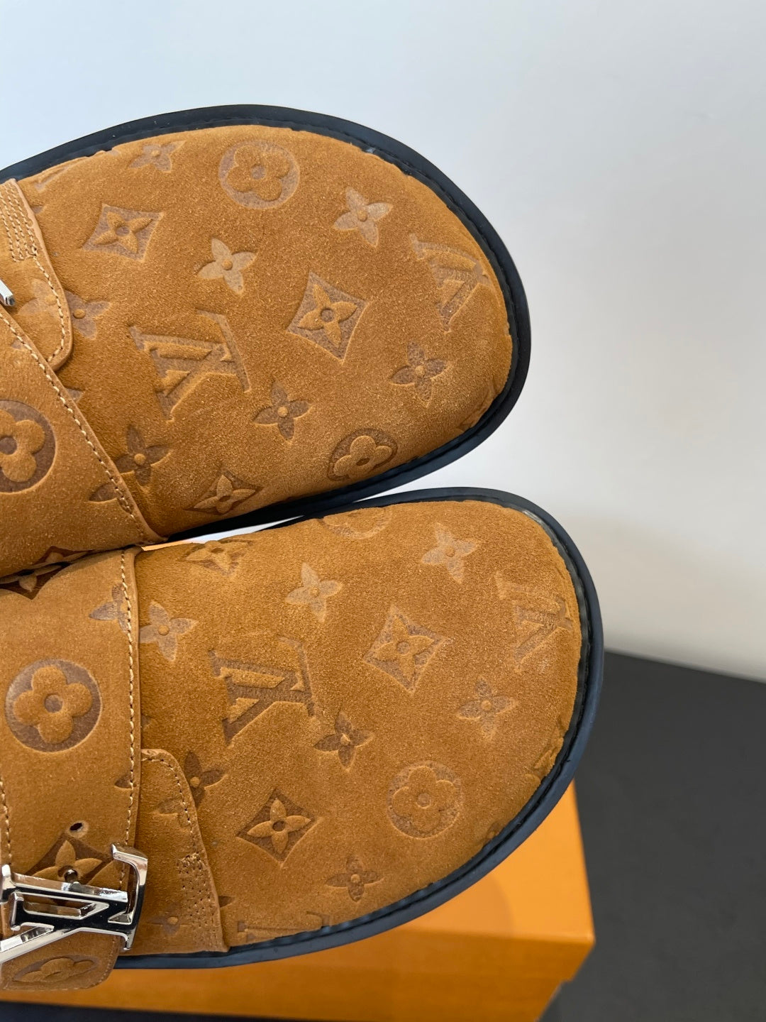 Louis Vuitton monogram sandal close-up, tan footbed with embossed monogram pattern