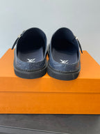 Louis Vuitton navy slide sandals showing open top and embossed sides