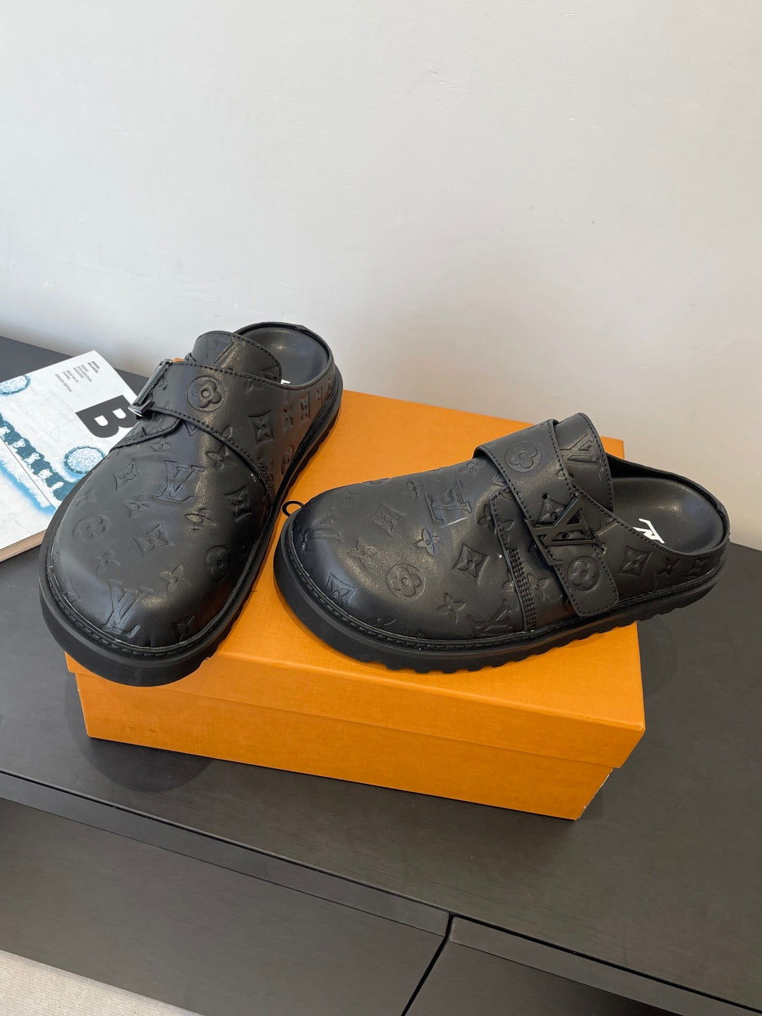 Louis Vuitton leather sandals with embossed monogram and adjustable strap, pair view