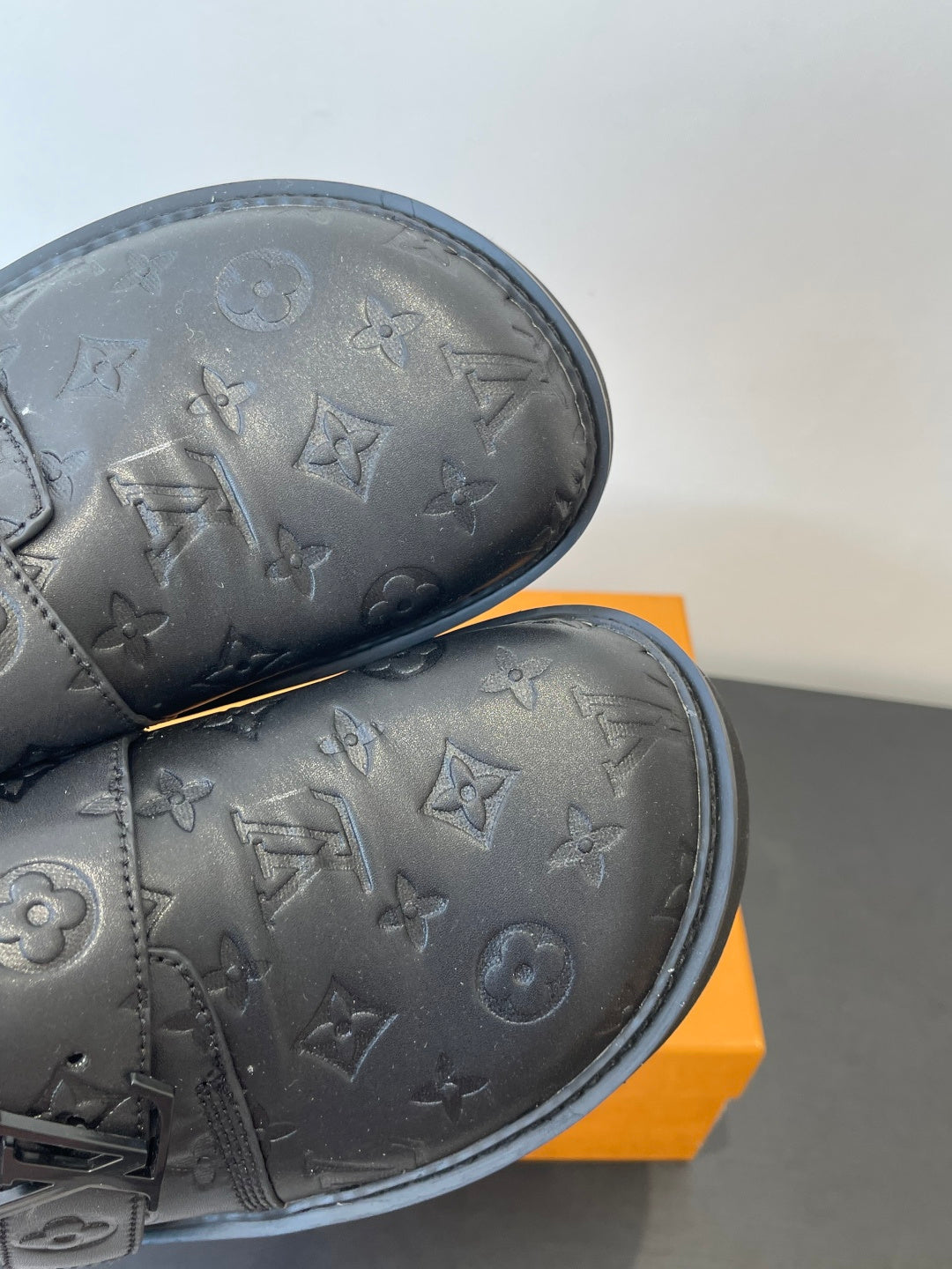 Louis Vuitton sandals close-up of embossed monogram leather and stitched edge