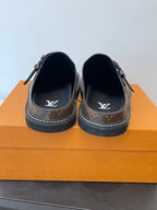 Louis Vuitton monogram slide sandals, back view with LV logos on insole