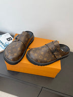 Louis Vuitton monogram sandals with buckle strap on orange box, side and front views
