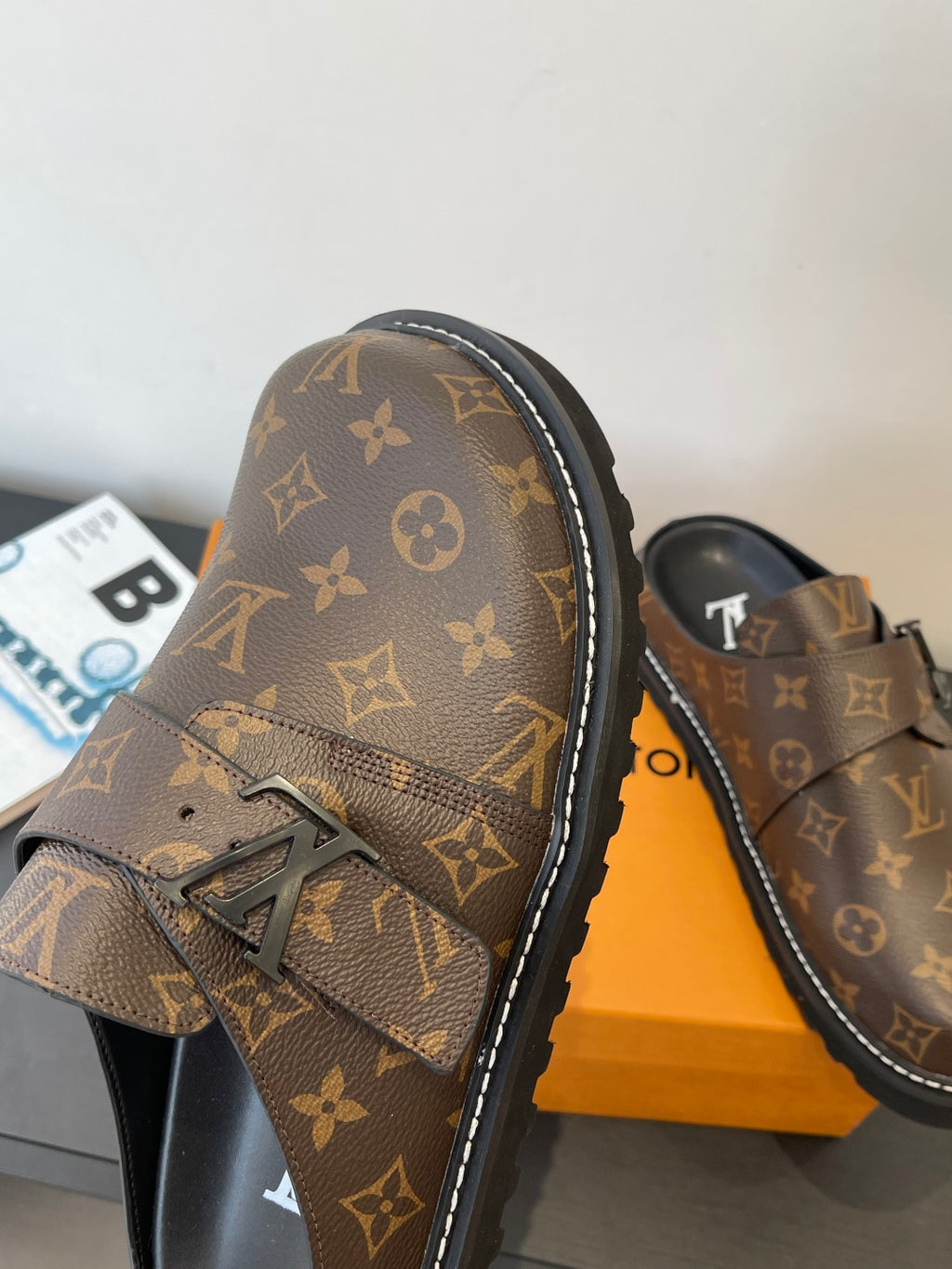 Louis Vuitton monogram sandals with front strap emblem and black stitched trim