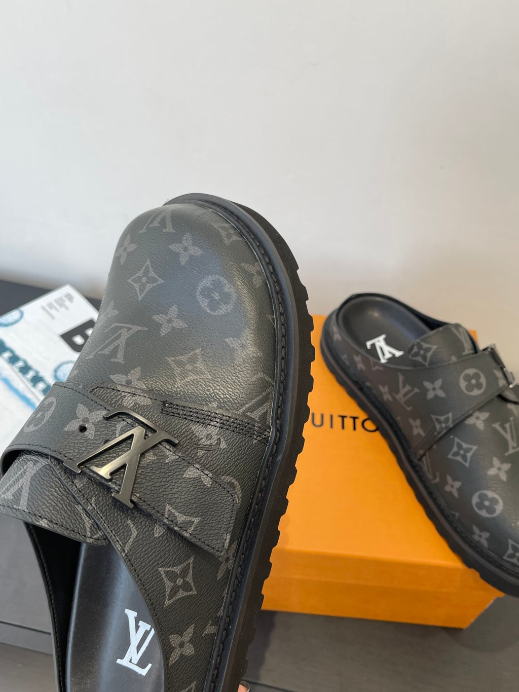 Louis Vuitton monogram sandals, close view of buckle strap and LV monogram
