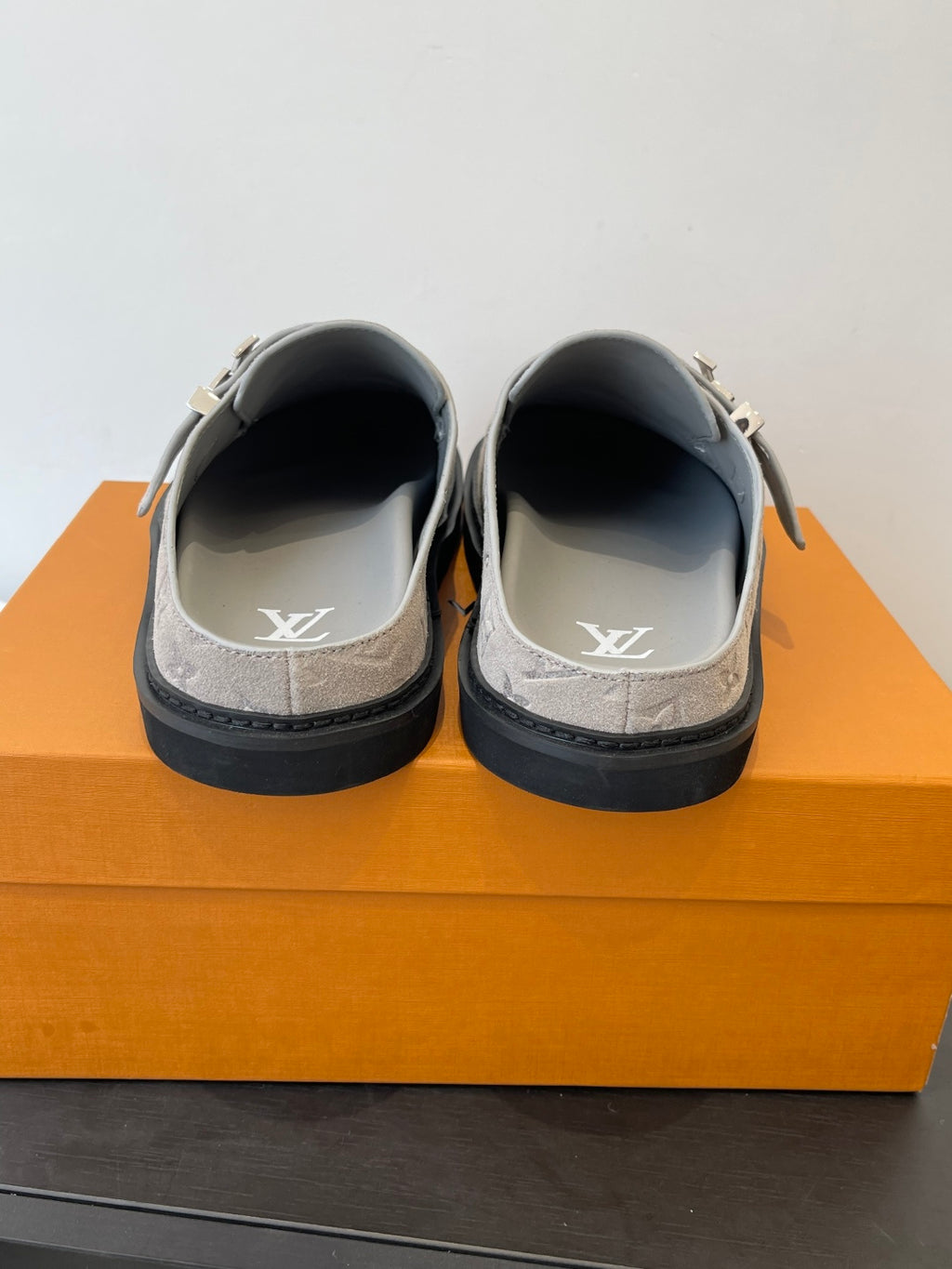 Louis Vuitton monogram slide sandals, heel and toe view with LV logo on insole