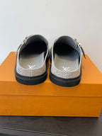 Louis Vuitton monogram slide sandals, heel and toe view with LV logo on insole