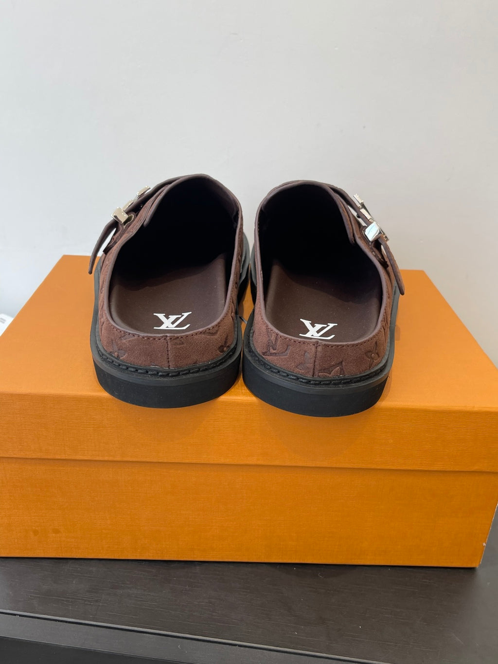 Brown monogram slip-on sandals with logo-printed insoles and metal buckle