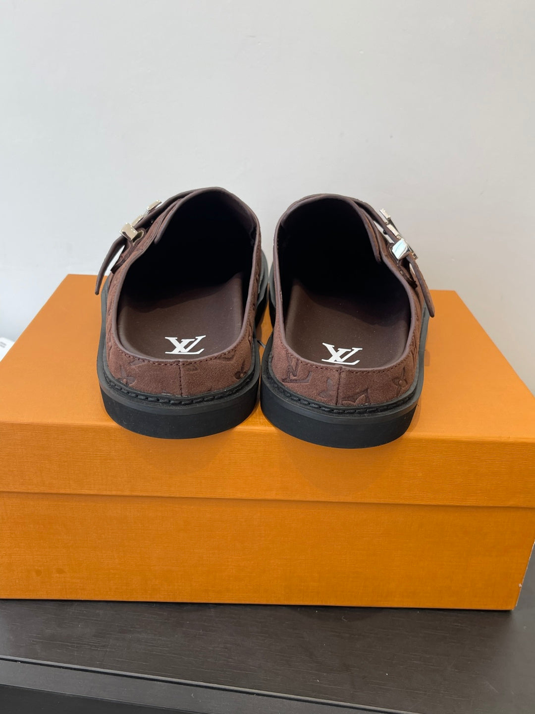 Brown monogram slip-on sandals with logo-printed insoles and metal buckle