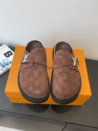 Brown monogram slip-on sandals with strap and dark rubber sole