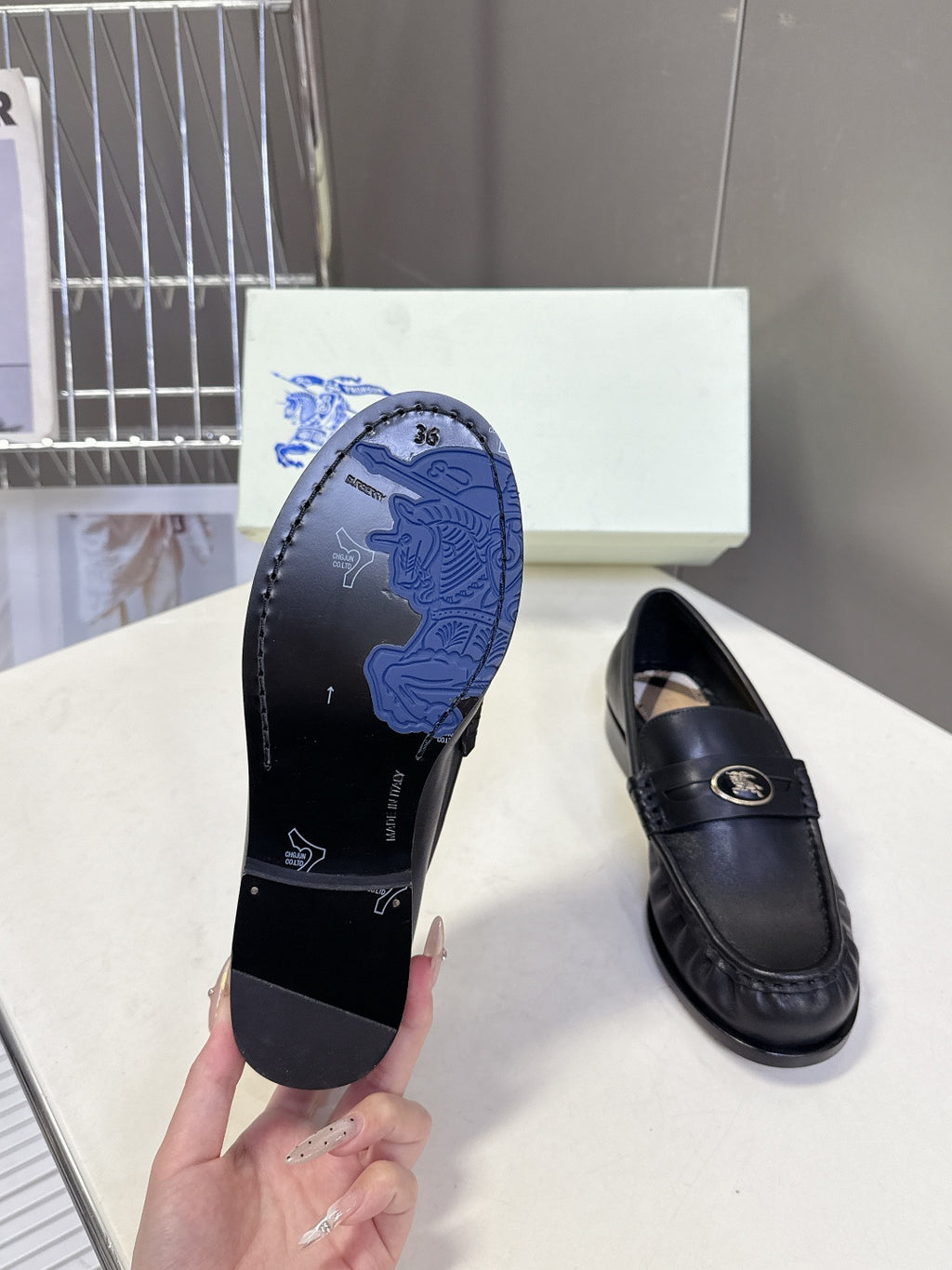 Burberry black leather loafer outsole with embossed logo tread, size 36