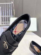 Burberry black leather loafer interior with plaid lining and logo insole