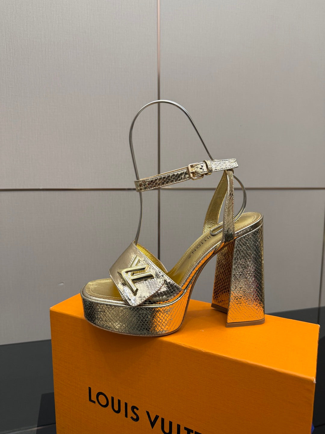 Louis Vuitton ladies metallic heeled sandal with T-strap and chunky heel, side view