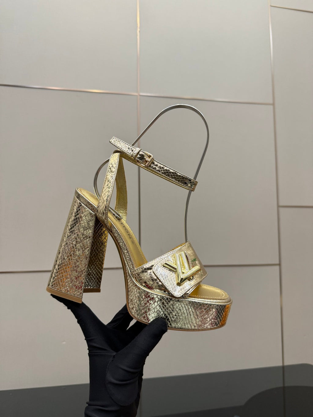 Louis Vuitton ladies metallic heeled sandal with T-strap and platform, front angled view